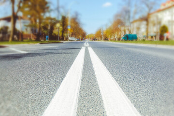 A road going into the distance in the autumn city