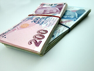 2 stacks of money on a white background