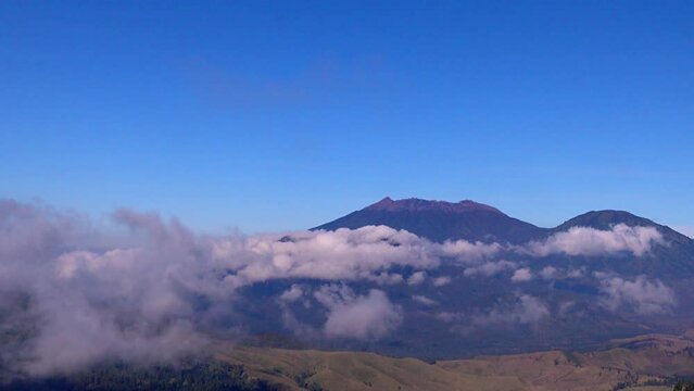 View of Mount Raung with clouds surrounding seen from Mount Ijen, Banyuwangi, East Java, Indonesia