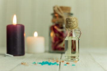 Aroma oil bottle and aroma candles, background with space for text