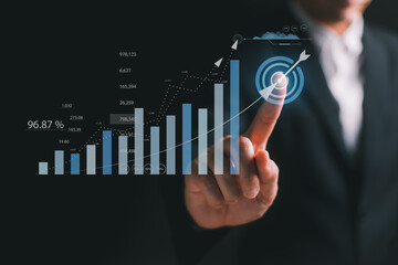Businessman plan graph growth and increase of chart positive indicators in his business. Business development to success and growing growth concept.