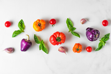Food composition. Creative layout made of organic vegetables and basil on white background. Top view