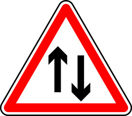 Vector graphic of a uk two way ahead road sign. It consists of two vertical arrows pointing in opposite directions contained within a red triangle