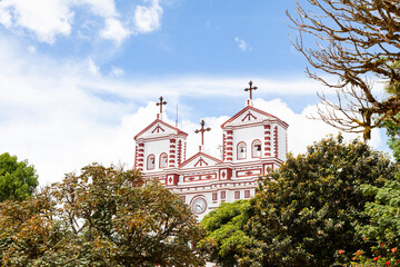 Fototapeta premium Guatape, Antioquia - Colombia - June 25, 2022. Our Lady of Carmen Catholic Church Facade.