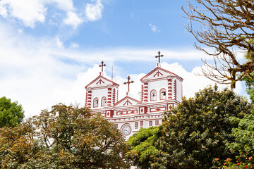 Guatape, Antioquia - Colombia - June 25, 2022. Our Lady of Carmen Catholic Church Facade.