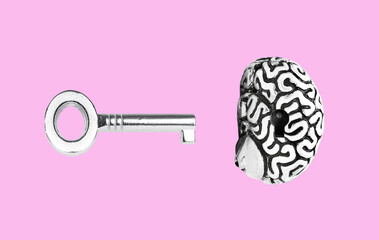 Human brain and master key floating on pink