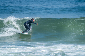 Surfer girl riding a wave