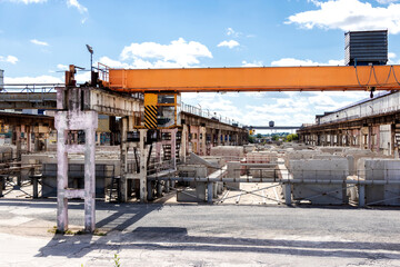 Fototapeta na wymiar Plant for the production of reinforced concrete slabs and foundation blocks for large-panel construction. Panels for the construction of reinforced concrete structures. Industrial enterprise.