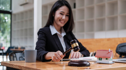 Business woman or lawyers working on wooden desk in office. Law, legal services, advice,Judge auction and real estate concept.