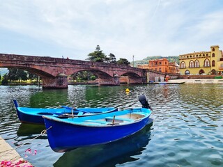 blue gondolas on the Temo river in Bosa (Sardinia)
