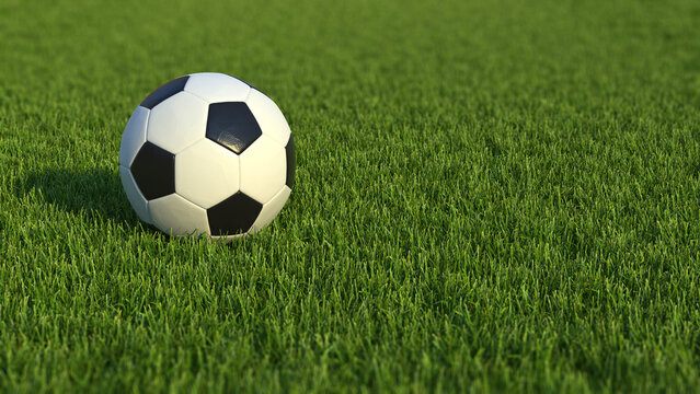 Close-up view of a soccer ball on the field. Football on the grass, with copy space.