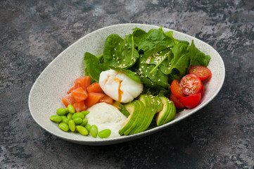 salad with salmon, avocado, beans and poached egg