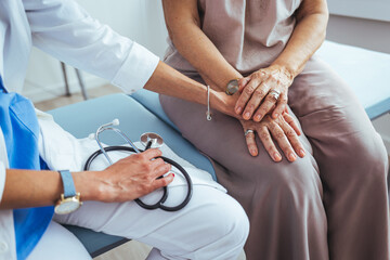 Doctor holding touching hands senior or elderly old lady woman patient with love, care, helping, encourage and empathy at nursing hospital ward: healthy strong medical concept