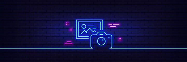 Neon light glow effect. Photo camera line icon. Image photography sign. Picture placeholder symbol. 3d line neon glow icon. Brick wall banner. Photo camera outline. Vector