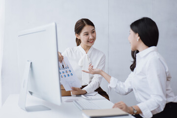 Fototapeta premium Business women are discussed and brainstorming on paperwork that show accounting numbers tables on office space.