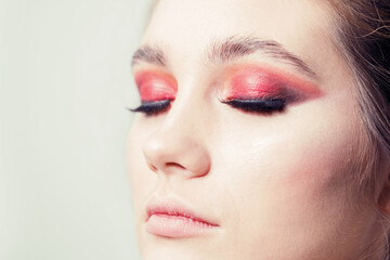 Fototapeta premium Makeup in a bright red version. Close-up.