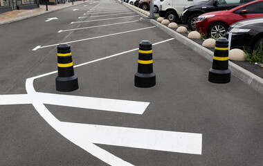 Concrete painted posts on the road