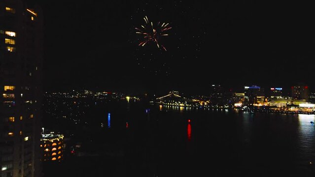 Aerial falling back from fireworks on July 4th, in Norfolk, Virginia.  Loud aerials burst in the air to celebrate Independence Day, a much-loved summer tradition in the United States of America,