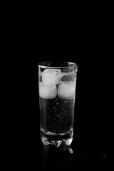 Glass of water filled with ice cubes