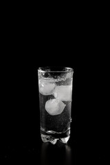 Glass of water filled with ice cubes