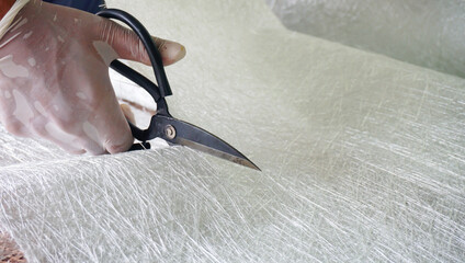 Cut raw material fiber glass chopper mat stand close up