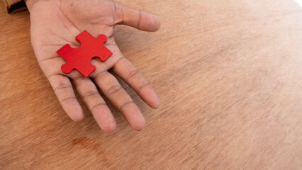 Hand hold jigsaw. concept of missing a key success