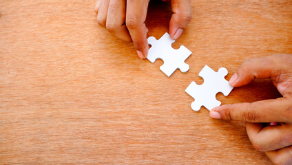 Hand hold jigsaw and try to complete assembly