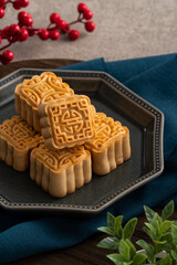 Delicious mung bean moon cake for Mid-Autumn Festival food mooncake on gray table background.
