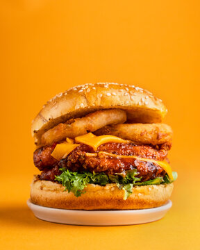 Chicken Burger Korean Fried Stacked Editorial Food Photography Yellow Backdrop Advertisement, mcdonalds, kfc, burgerking 