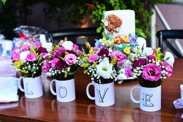 flowers in the cup, four white cups, love cups, decoration with cups, white porcelain cups decoration whit flowers