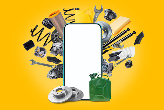 A various of new car spare parts and blank smartphone with white screen for your text or design on yellow background. Template for an application for the sale of spare parts for vehicles.