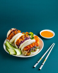 Bao Baos Chicken Fried Vegetable Sauce Chopsticks Editorial Food Photography Green Backdrop With Space For Text, Korean Chinese Japanese 