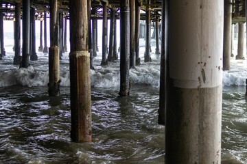 Beautiful shot of the pillars under the Santa Monica Pier