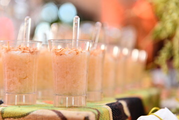 glasses on a table, rice pudding in a cup, typical food, June food, São João festival buffet, June festival, rice pudding with cinnamon, blurred background