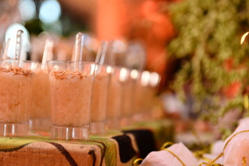 glasses on a table, rice pudding in a cup, typical food, June food, São João festival buffet, June festival, rice pudding with cinnamon, blurred background