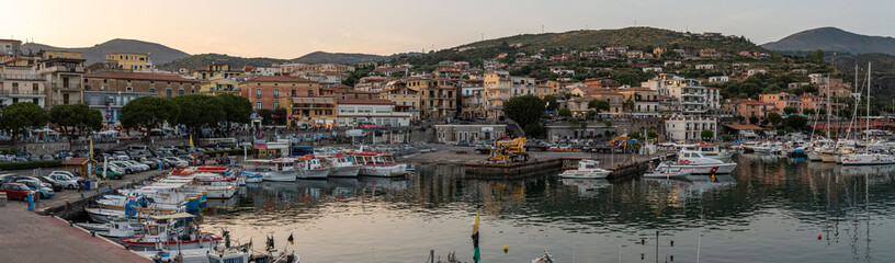 View of Marina di Camerota port and waterfront at sunset, Campania, Italy