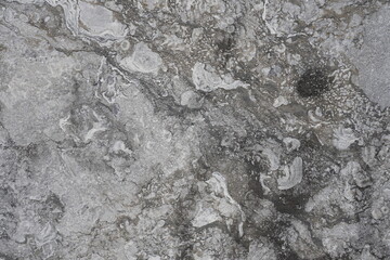Natural stone, close up of gray beautifully textured natural stone slab facade as background of...