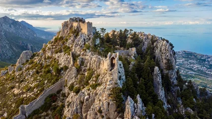 Foto auf Acrylglas Aerial drone shot of the St. Hilarion Castle Peak in Karmi, Cyprus © Zoltán Nagy/Wirestock Creators