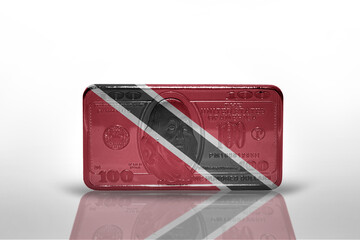 national flag of trinidad and tobago on the dollar money banknote on the white background .