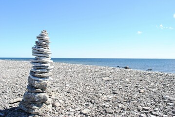 Stack of pebbles on the beach with the concept of zen and peace