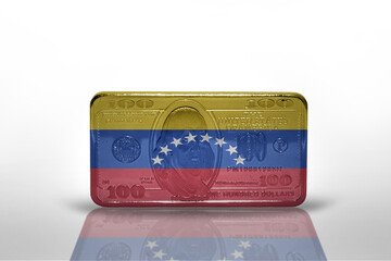 national flag of venezuela on the dollar money banknote on the white background .