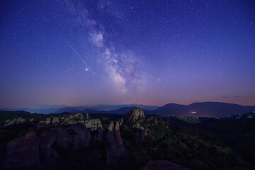 Milky Way and the Perseids. Long time exposure night landscape with Milky Way Galaxy during the Perseids flow above the Belogradchik Rocks in Balkan Mountains, Bulgaria © Jess_Ivanova