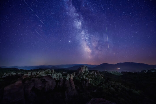 Milky Way and the Perseids. Long time exposure night landscape with Milky Way Galaxy during the Perseids flow above the Belogradchik Rocks in Balkan Mountains, Bulgaria