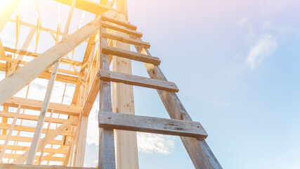 Ladder leaned onto carcass of building at construction site