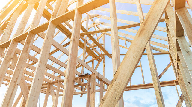 Building carcass made of wooden boards at construction site