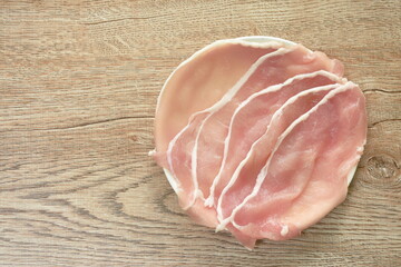 slice pork tenderloin raw food arranging on plate 