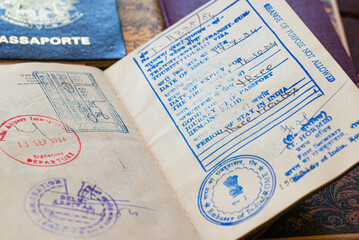 Old Indian Visa with arrival and departure dates on a passport. Holidays concept.