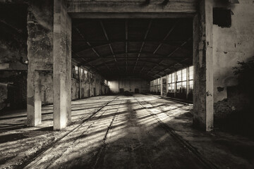 Fototapeta na wymiar Old abandoned factory building or warehouse on sunny summer day