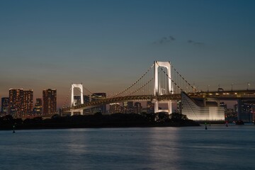 Mesmerizing view of Rainbow bridge at night in Tokyo, Japan