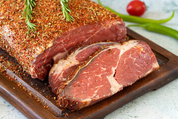 Special entrecote. Beef entrecote specially prepared with spices on a stone background. Butcher products. close up